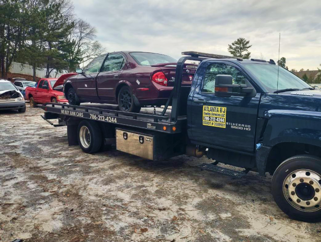 Scrap car being picked up by our towing trucks